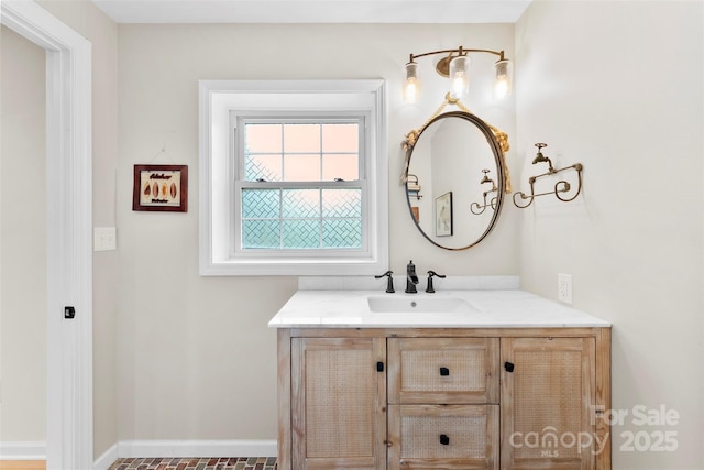 bathroom featuring vanity and baseboards