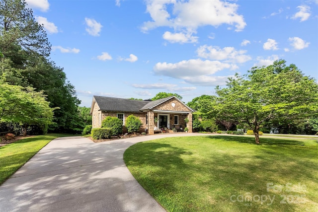 11 Secrest Ext, Belmont, NC 28012 - view of front of house with a front yard, brick siding, a porch, and curved driveway