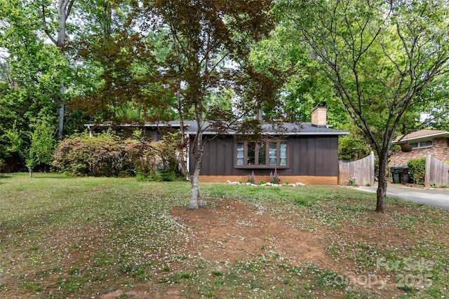846 Gist Rd, Rock Hill, SC 29732 - single story home with board and batten siding, fence, and a chimney