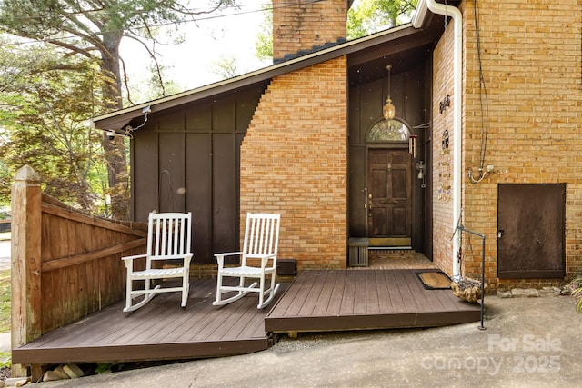 846 Gist Rd, Rock Hill, SC 29732 - doorway to property featuring brick siding, board and batten siding, a chimney, and a deck