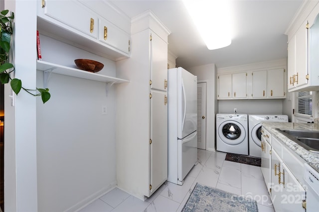 846 Gist Rd, Rock Hill, SC 29732 - washroom with marble finish floor, washing machine and dryer, baseboards, a sink, and cabinet space