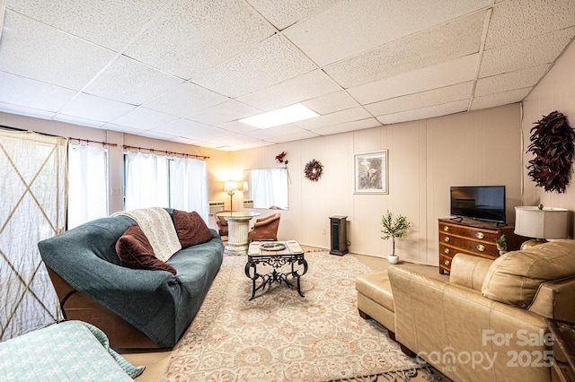 310 1st St NE, Hickory, NC 28601 - carpeted living area with a decorative wall and a paneled ceiling