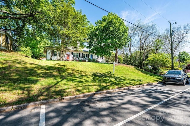 310 1st St NE, Hickory, NC 28601 - view of front of property with covered porch and a front yard