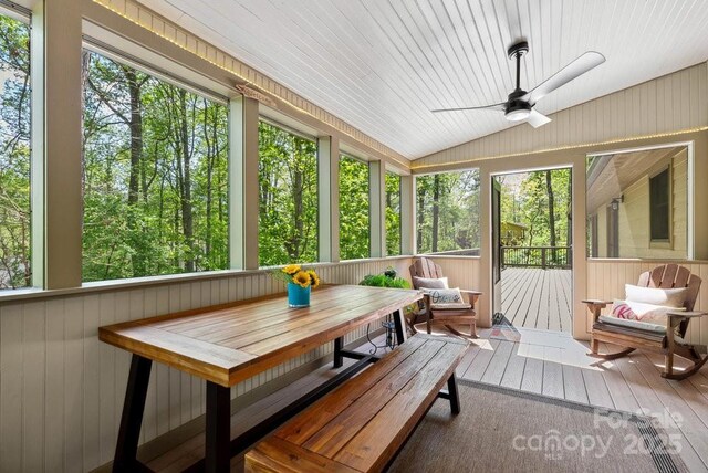 sunroom featuring outdoor dining space and ceiling fan