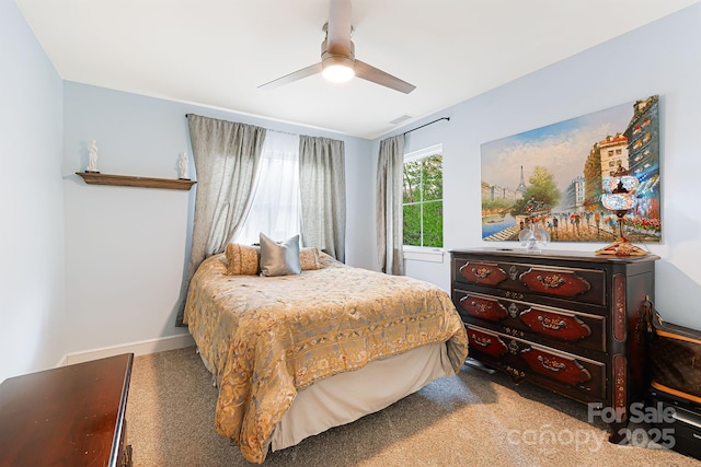 carpeted bedroom with visible vents and ceiling fan