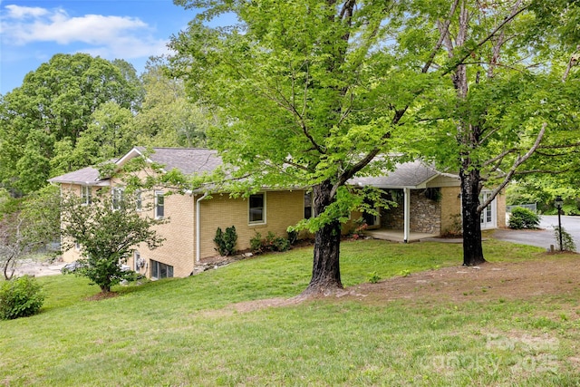 159 Amble Ln, Fletcher, NC 28732 - exterior space featuring brick siding and a front yard