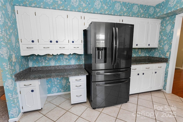 159 Amble Ln, Fletcher, NC 28732 - kitchen with wallpapered walls, white cabinetry, stainless steel fridge, and light tile patterned floors