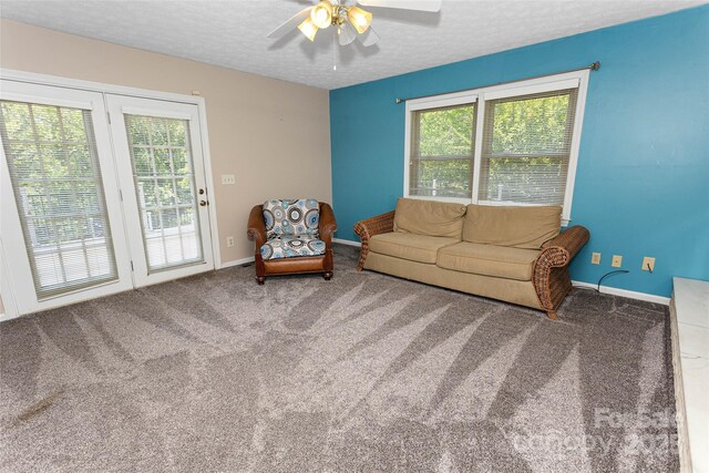 159 Amble Ln, Fletcher, NC 28732 - carpeted living area with a ceiling fan, baseboards, and a textured ceiling