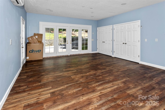 159 Amble Ln, Fletcher, NC 28732 - unfurnished bedroom with french doors, baseboards, and a wall mounted AC