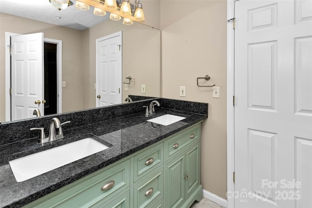 159 Amble Ln, Fletcher, NC 28732 - bathroom featuring baseboards, double vanity, and a sink