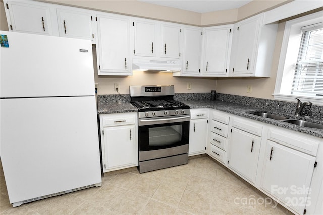 159 Amble Ln, Fletcher, NC 28732 - kitchen with stainless steel gas range, a sink, freestanding refrigerator, white cabinetry, and under cabinet range hood