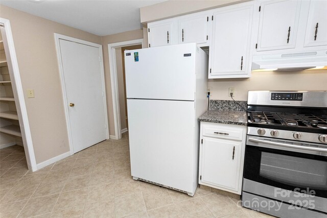 159 Amble Ln, Fletcher, NC 28732 - kitchen with freestanding refrigerator, stainless steel gas range, custom exhaust hood, dark stone countertops, and white cabinets