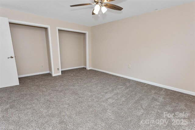 159 Amble Ln, Fletcher, NC 28732 - unfurnished bedroom with baseboards, a ceiling fan, multiple closets, and carpet floors