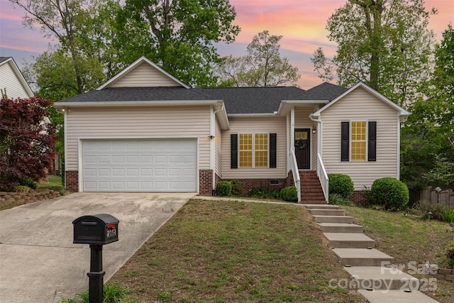 single story home with an attached garage, driveway, roof with shingles, and a front yard