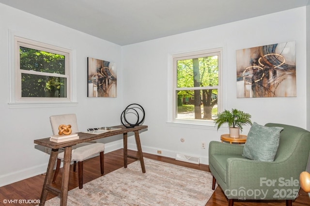 1501 Briarfield Dr, Charlotte, NC 28205 - home office with baseboards, wood finished floors, and visible vents