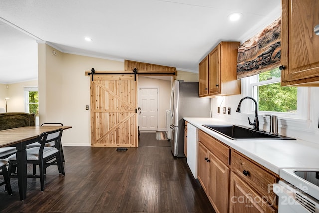 37 Bittersweet Dr, Hendersonville, NC 28792 - kitchen with lofted ceiling, a sink, a barn door, brown cabinetry, and dishwasher