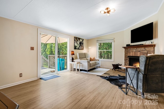 37 Bittersweet Dr, Hendersonville, NC 28792 - living area featuring a fireplace, healthy amount of natural light, wood finished floors, lofted ceiling, and baseboards