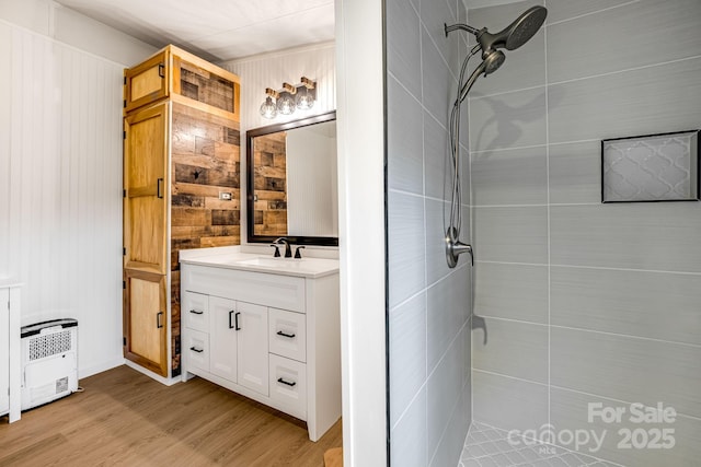 37 Bittersweet Dr, Hendersonville, NC 28792 - full bath featuring vanity, a tile shower, wood finished floors, wooden walls, and heating unit