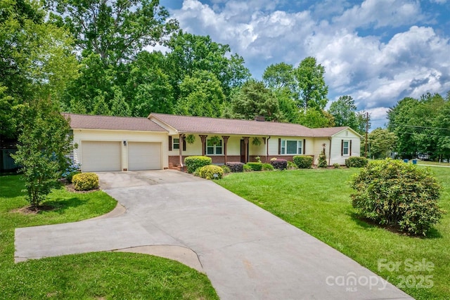 4897 Calico Rd, Lenoir, NC 28645 - ranch-style house with a garage, concrete driveway, a front yard, covered porch, and brick siding