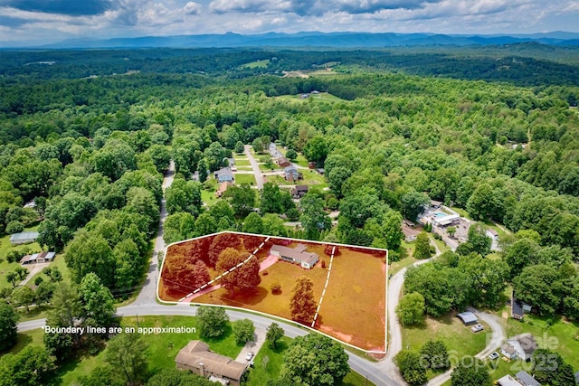 4897 Calico Rd, Lenoir, NC 28645 - aerial view of property's location featuring property boundaries highlighted and a mountain backdrop