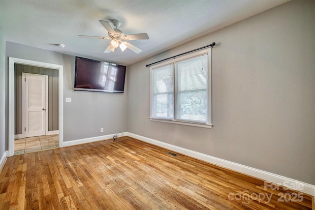 4897 Calico Rd, Lenoir, NC 28645 - spare room with ceiling fan, light wood finished floors, and a smoke detector
