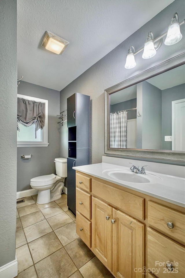 4897 Calico Rd, Lenoir, NC 28645 - full bath featuring vanity, tile patterned flooring, a textured wall, a shower with shower curtain, and a textured ceiling