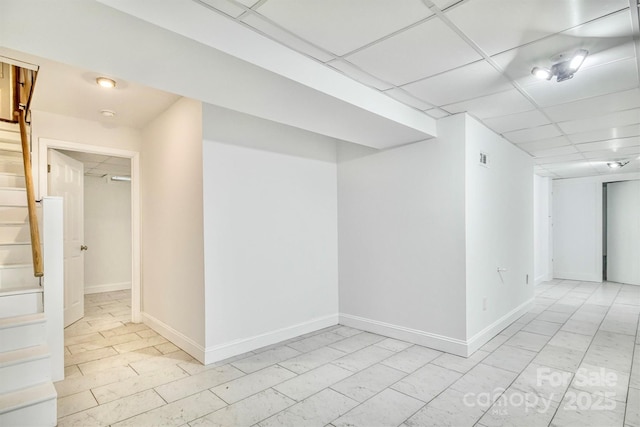 4897 Calico Rd, Lenoir, NC 28645 - unfurnished room with stairway, a drop ceiling, and light marble finish floors