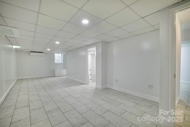 4897 Calico Rd, Lenoir, NC 28645 - basement with a wall mounted AC, recessed lighting, and a paneled ceiling