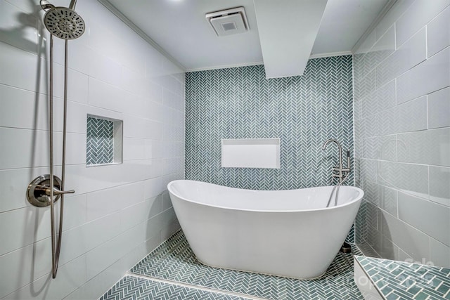 4897 Calico Rd, Lenoir, NC 28645 - bathroom with a soaking tub, tile walls, tile patterned floors, tiled shower, and ornamental molding