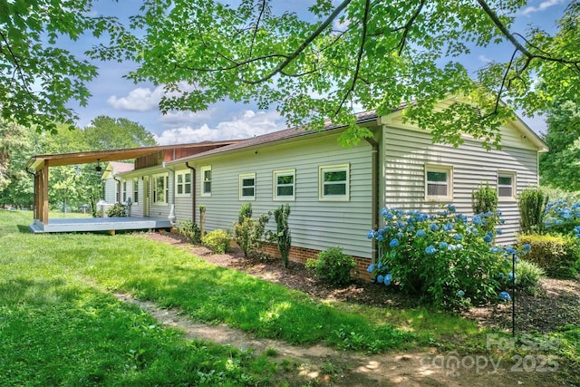 4897 Calico Rd, Lenoir, NC 28645 - back of house featuring a yard and a wooden deck