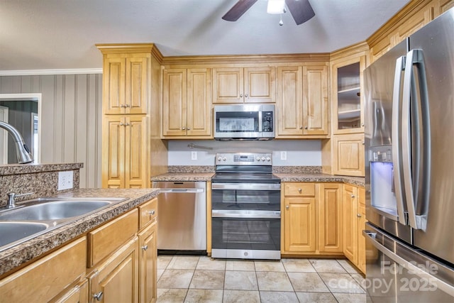4897 Calico Rd, Lenoir, NC 28645 - kitchen featuring stainless steel appliances, a ceiling fan, glass insert cabinets, ornamental molding, and light brown cabinets