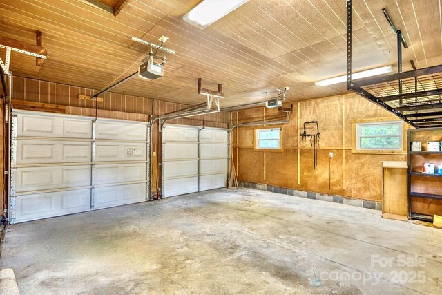 4897 Calico Road Lot 11A, Lot 11, Lot 11B, Lenoir, NC 28645 - garage with a garage door opener, wood ceiling, and wood walls