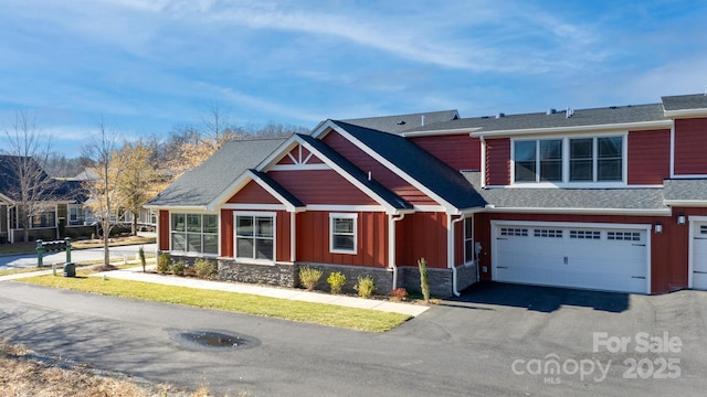 20 Brookstone Pl, Candler, NC 28715 - craftsman inspired home with board and batten siding, asphalt driveway, a garage, stone siding, and roof with shingles
