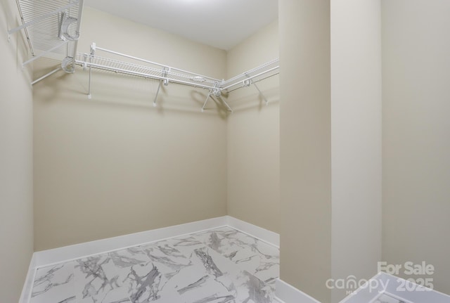 20 Brookstone Pl, Candler, NC 28715 - walk in closet featuring marble look tiles
