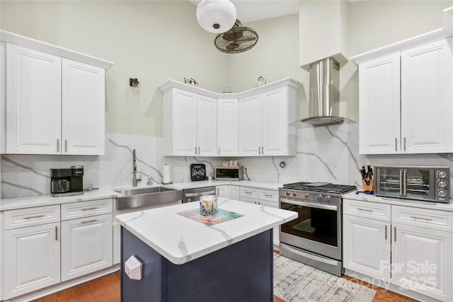 20 Brookstone Pl, Candler, NC 28715 - kitchen featuring appliances with stainless steel finishes, island range hood, white cabinets, and tasteful backsplash
