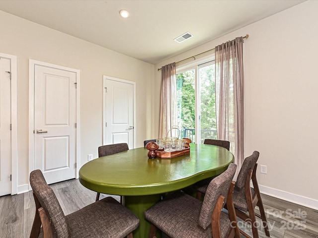 dining area featuring recessed lighting, visible vents, baseboards, and dark wood finished floors