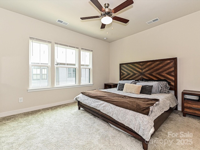 bedroom featuring visible vents, baseboards, a ceiling fan, and carpet floors