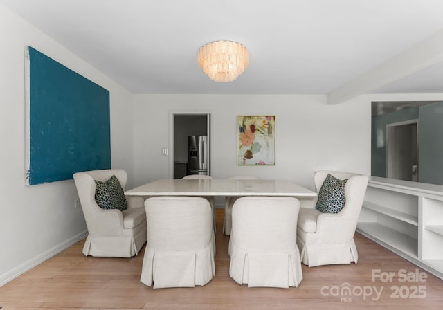 916 E Park Dr, Lincolnton, NC 28092 - dining space featuring wood finished floors, baseboards, and a chandelier