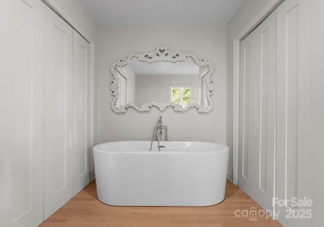 916 E Park Dr, Lincolnton, NC 28092 - bathroom with wood finished floors and a freestanding bath