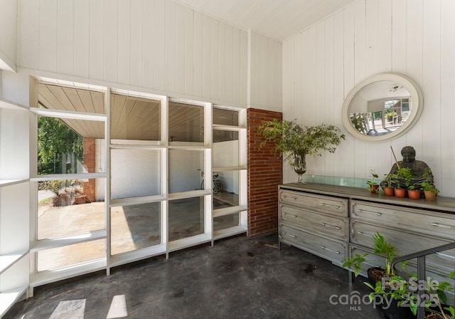 916 E Park Dr, Lincolnton, NC 28092 - interior space with concrete floors and wooden walls