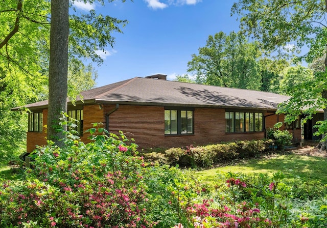 916 E Park Dr, Lincolnton, NC 28092 - view of property exterior with brick siding and a chimney