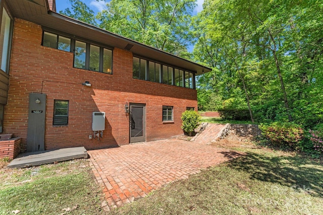 916 E Park Dr, Lincolnton, NC 28092 - rear view of property with a patio and brick siding