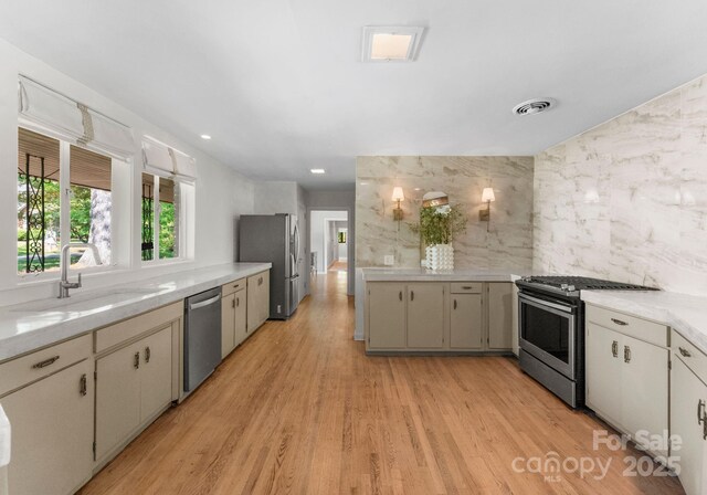916 E Park Dr, Lincolnton, NC 28092 - kitchen featuring stainless steel appliances, light wood-type flooring, and tile walls