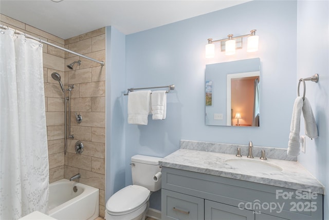 bathroom with vanity, shower / bath combo, and toilet