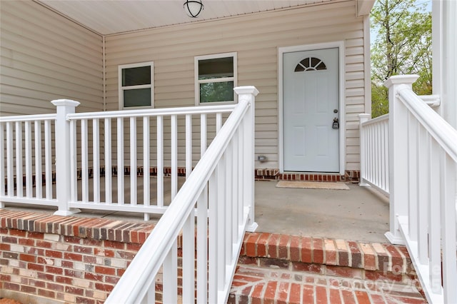 property entrance with covered porch