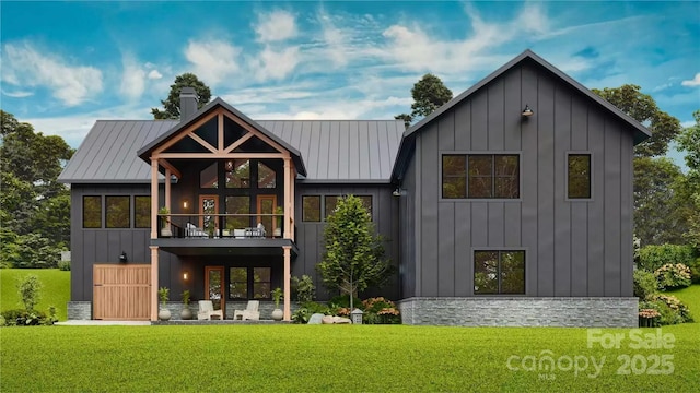 back of house featuring board and batten siding, a balcony, and a lawn