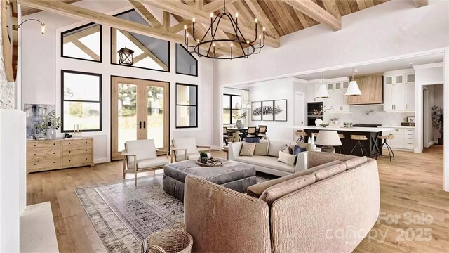 living area with high vaulted ceiling, beamed ceiling, an inviting chandelier, and french doors