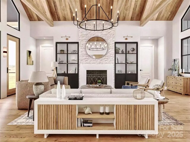 living room with beamed ceiling, high vaulted ceiling, a chandelier, and wood ceiling
