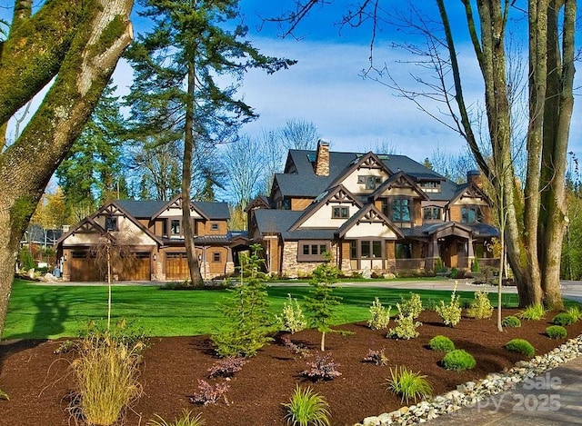 view of front of house featuring stone siding and a front lawn