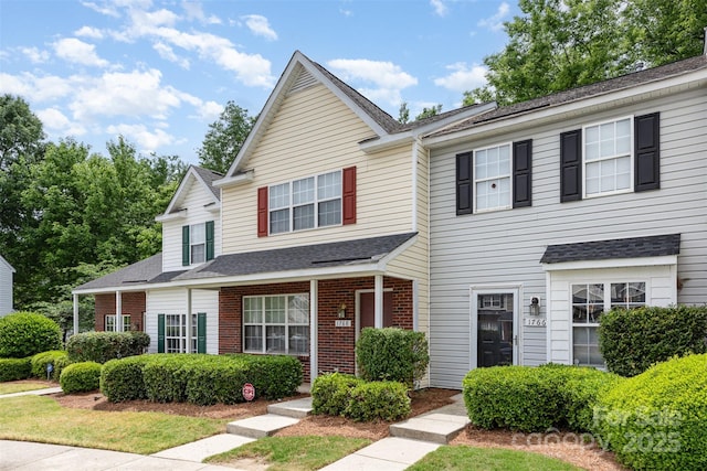 1766 Forest Side Ln, Charlotte, NC 28213 - view of front facade featuring roof with shingles and brick siding
